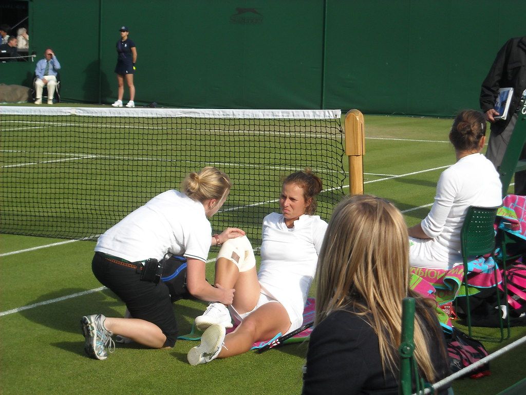 A player receives treatment on court during an injury time-out