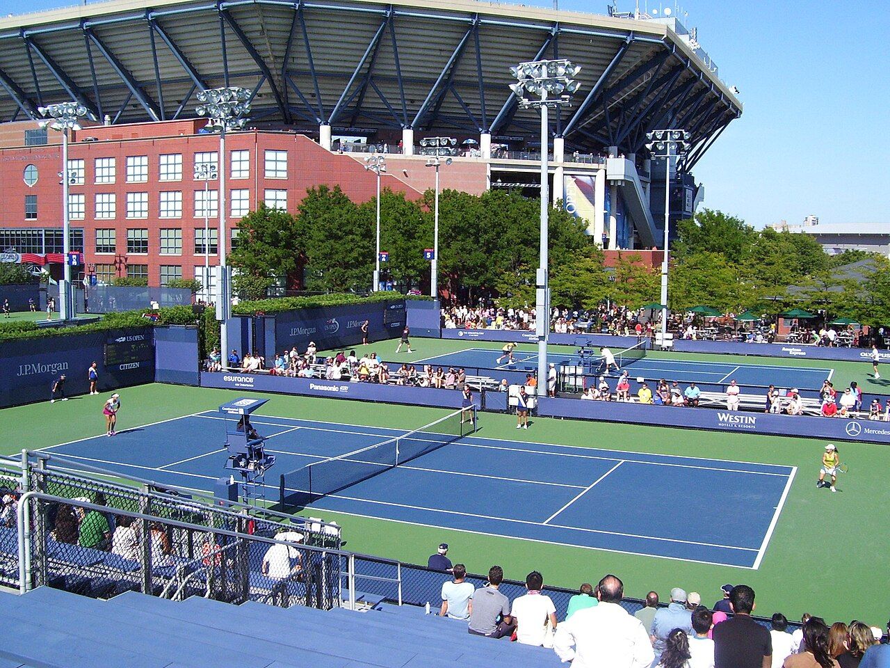 Outside courts and the main stadium at a hard-court tournament