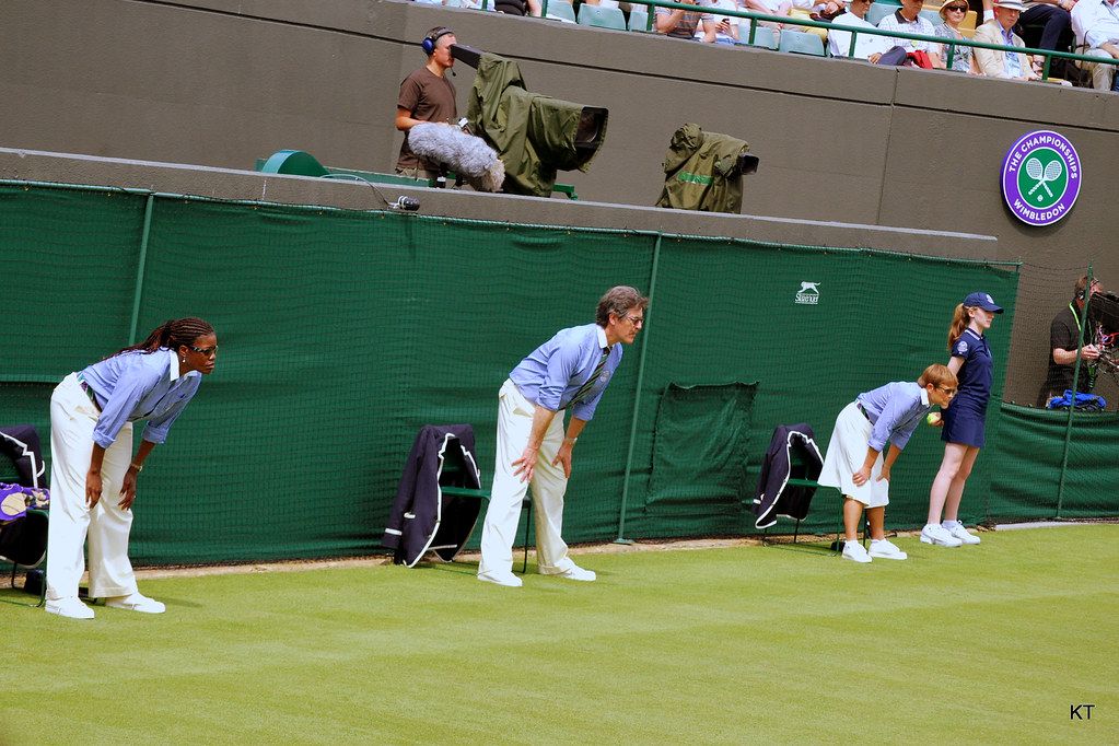 Line judges crouched along the baseline