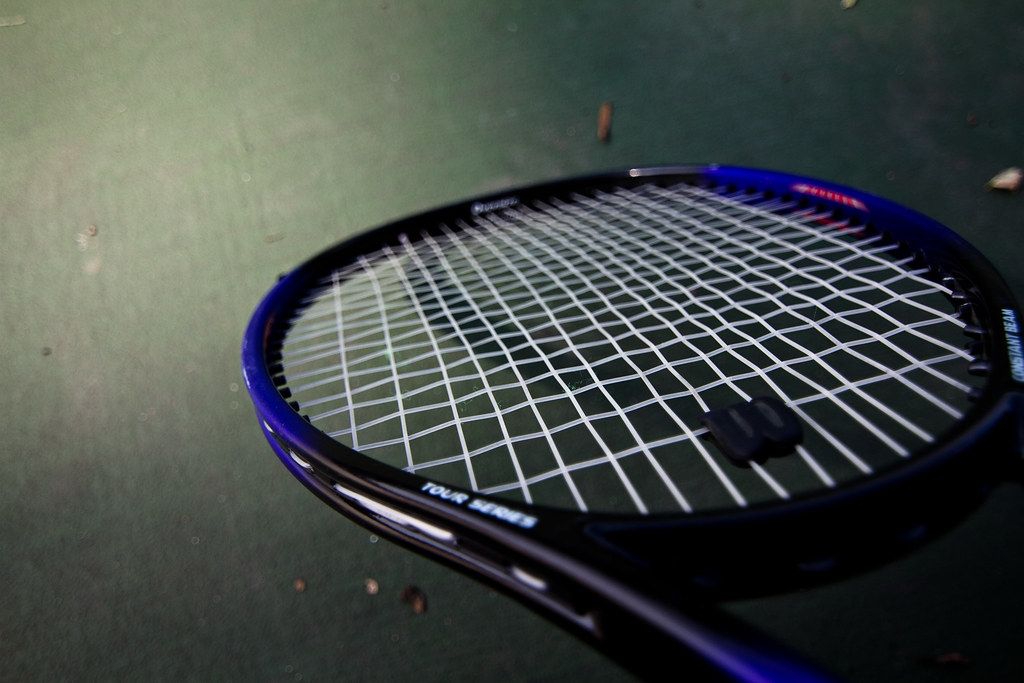 Close-up of the string bed of a tennis racquet